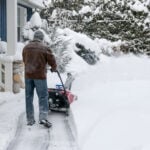 bigstock Man using snowblower to clear 77541071